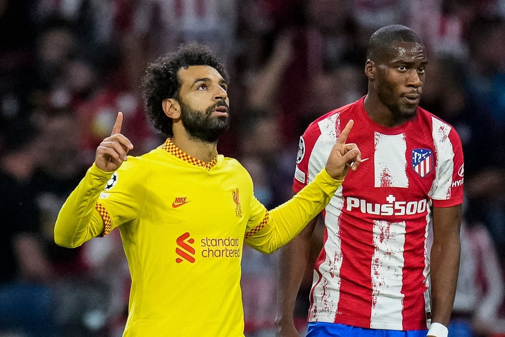 Mohamed Salah (l) sorgte für Liverpools Siegtreffer bei Atlético Madrid.