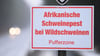 Ein Schild mit der Aufschrift "Afrikanische Schweinepest bei Wildschweinen, Pufferzone".&nbsp;