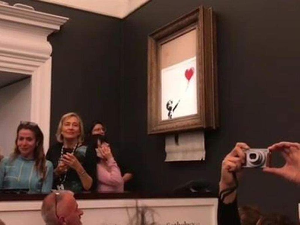 Ein Banksy wird geschreddert. Foto: Banksy/Press Association Images