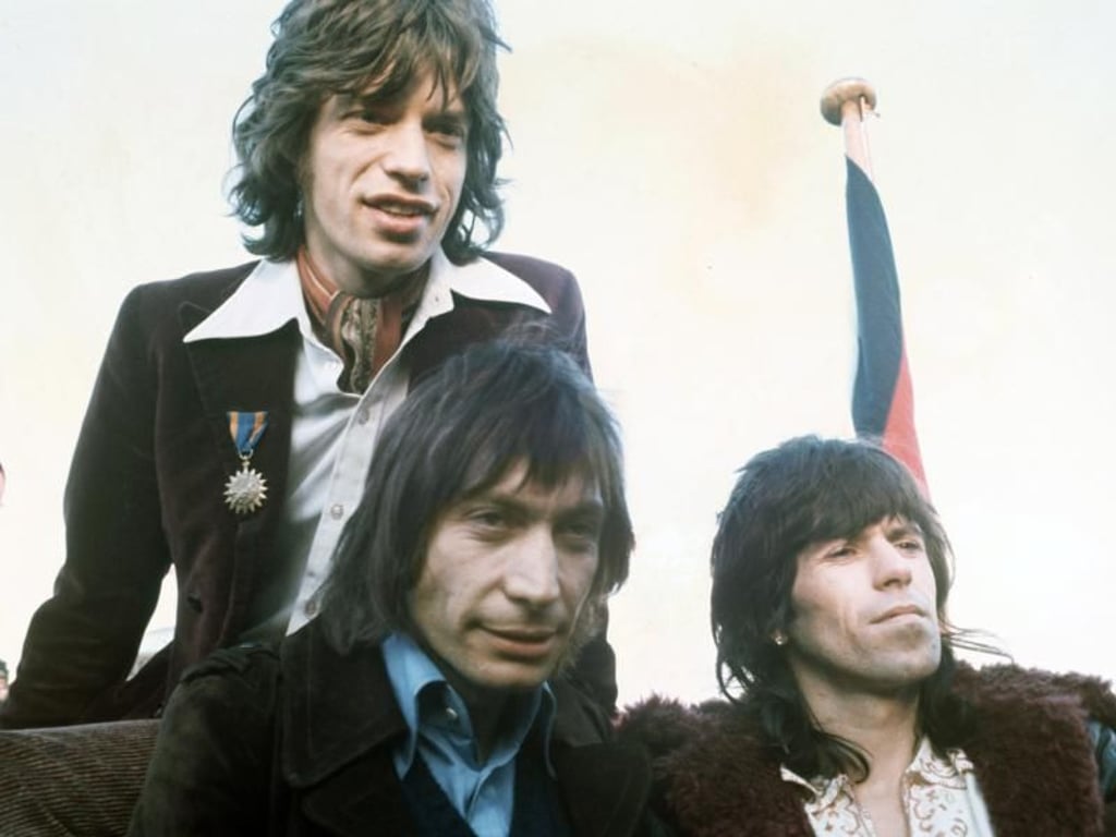 Wilde Jungs: Mick Jagger (l-r), Charlie Watts und Keith Richards 1970 bei einer Pressekonferenz. Foto: Dieter Klar