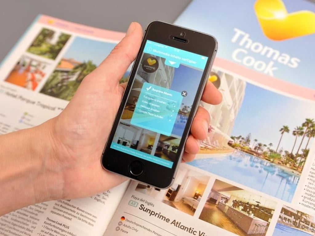 Digitale Zusatzinfos zu vielen Katalogangeboten bietet die App «Thomas cook Travel Insight» - einfach das entsprechende Symbol mit der Smartphone-Kamera scannen. Foto: Thomas Cook