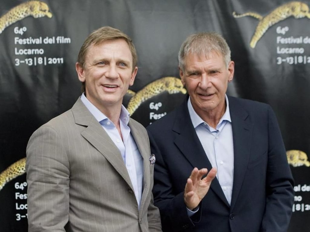 Daniel Craig (l.) und Harrison Ford 2011 beim Filmfestival in Locano. Foto: Jean-Christophe Bott
