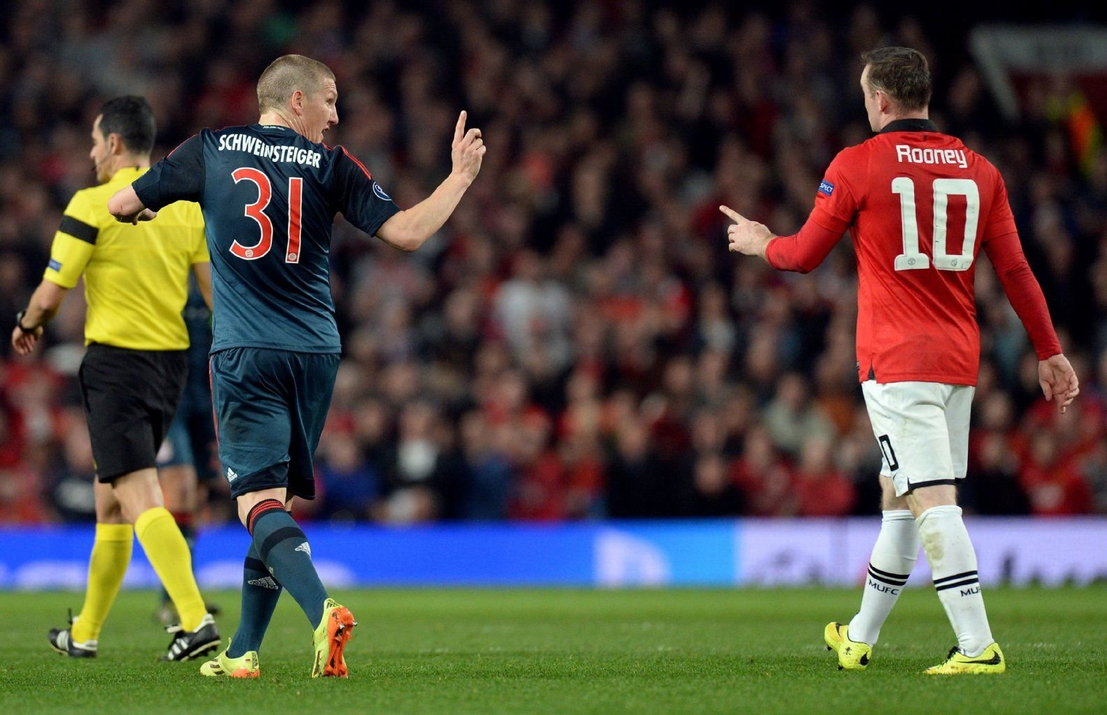 Nicht immer einer Meinung, aber bald in einem Team: Bastian Schweinsteiger und Wayne Rooney.