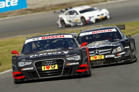 Audi-Pilot Edoardo Mortara (Italien, Team Rosberg) fährt in Zandvoort vor Gary Paffett (Großbritannien, HWA AG, DTM AMG Mercedes C-Coupe) und Martin Tomczyk (Deutschland, BMW Team RMG, BMW M3 DTM). Mortara gewann den siebten Saisonlauf im Deutschen Tourenwagen Masters (DTM). (FOTO: DPA)