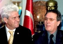 German coach Werner Lorant (L) shares a smile with Fenerbahce Istanbul president Aziz Yildirim during a press conference in Istanbul on Thursday, 03 January 2002, where he was presented as new coach of Turkish champions Fenerbahce Istanbul. Lorant, who led German Bundesliga club 1860 Munich from obscurity to the Champions League qualification in his nine seasons in Bavaria before being sacked in October 2001, signed a contract of two and half years.