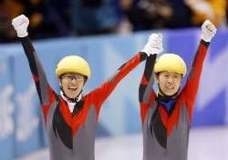 China's winner Yang Yang (A, left) and bronze medalist Yang Yang (S) jubilate after the women's 1000m short track speed skating event at the Ice Center, 23 February 2002 during the XIXth Winter Olympics in Salt Lake City. Silver medalist is South Korean Gi-Hyun Ko. dpa