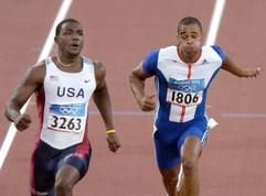 Justin Gatlin (l.) siegt, Jason Gardener läuft hinterher. (Foto: dpa)