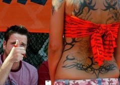 Wer hat das schönste Geweih? Mit Tätowierungen lässt sich Aufsehen erregen - im Bild eine «Geweihträgerin», die während eines Wettstreits in Berlin am 8. August 2004 von D.J. Q-Ball von der Band «The Bloodhound Gang» begutachtet wird. (Foto: dpa)