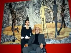 Der Maler Jörg Immendorff zeigt sich am Donnerstag (22.09.2005) in der Neuen Nationalgalerie in Berlin mit seiner Frau Oda vor einem seiner Bilder (2005, ohne Titel). (Foto: dpa)