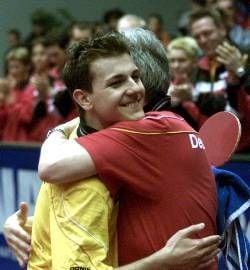 Timo Boll (L) and his Coach Istvan Korpa embrace each other after Boll won the final match of the Super Division men's single table tennis European Championship in Zagreb, Sunday 07 April 2002. Timo Boll defeated Kalinikos Kreanga of Greece 4-2. dpa