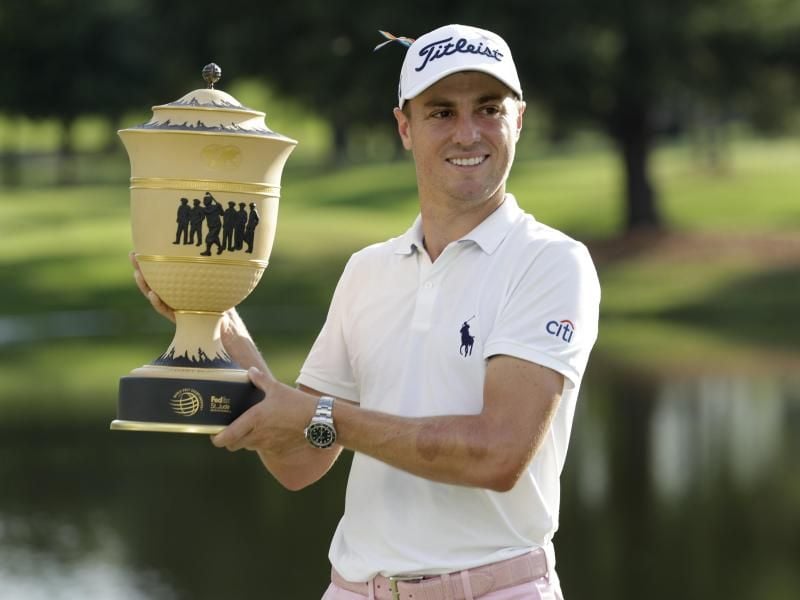 Justin Thomas aus den USA freut sich über seinen Sieg. Foto: Mark Humphrey/AP/dpa