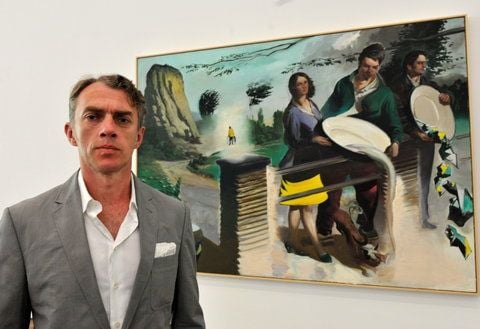Der Leipziger Künstler Neo Rauch steht im Museum Frieder Burda in Baden-Baden vor seinem Ölgemälde «Ausschüttung» aus dem Jahre 2009. (FOTO: DPA)