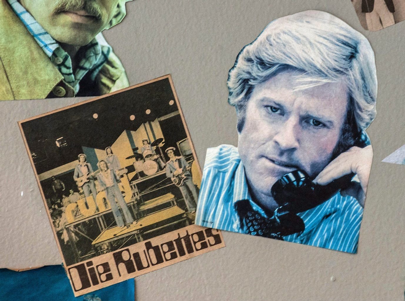 Ausgeschnittene Fotos von US-Schauspieler Robert Redford und der britischen Popgruppe "The Rubettes" auf einer Wand im ehemaligen Staatsratsgebäude der DDR.