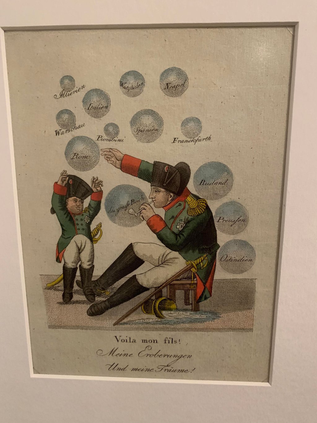 In dieser Karikatur in der Sonderausstellung des Kulturhistorischen Museums Magdeburg zeigt Napoleon seinem Sohn seine Ziele und Träume – in Form von Seifenblasen, die wohl alsbald zerplatzen.