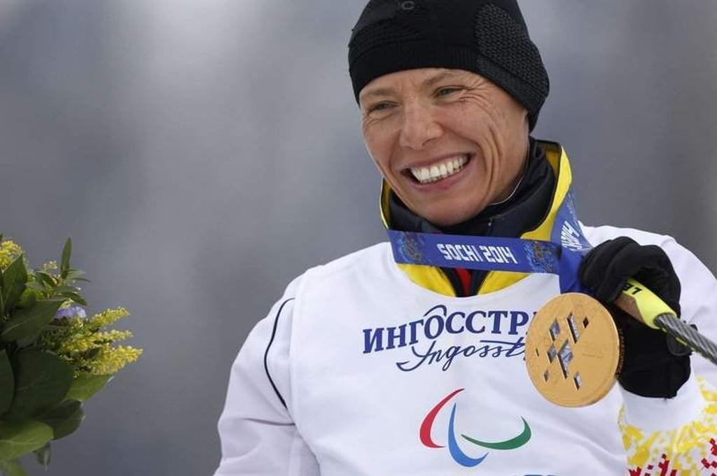 epa04127942 Gold medalist Andrea Eskau of Germany celebrates during the medal ceremony after the Cross Country 5km Sitting competition at Laura Cross-Country Ski & Biathlon Center during the Sochi 2014 Paralympic Games, Krasnaya Polyana, Russia, 16 March 2014. EPA/VALDRIN XHEMAJ +++(c) dpa - Bildfunk+++