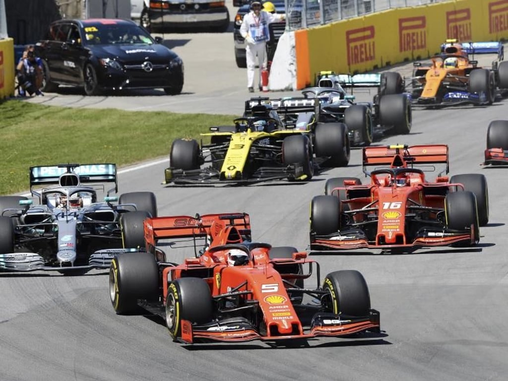 Sebastian Vettel führt das Fahrerfeld kurz nach dem Rennstart an. Foto: Ryan Remiorz/The Canadian Press/AP