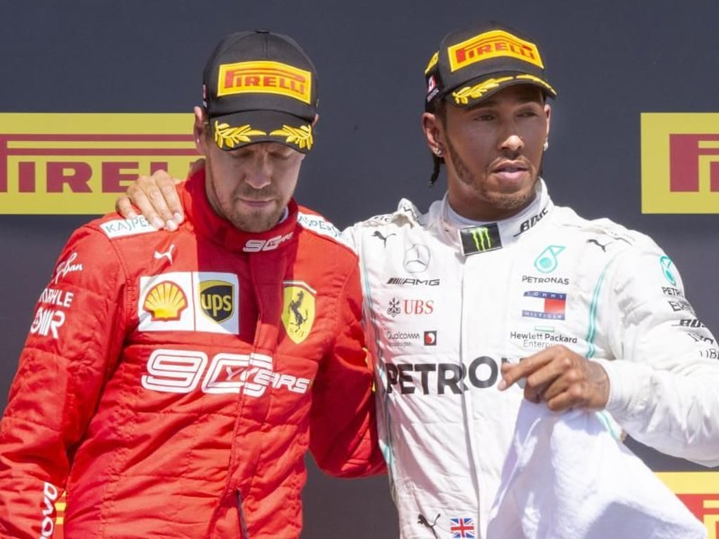 Sebastian Vettel (l) und Lewis Hamilton posieren nach dem Rennen für ein Foto. Foto: Paul Chiasson/The Canadian Press/AP