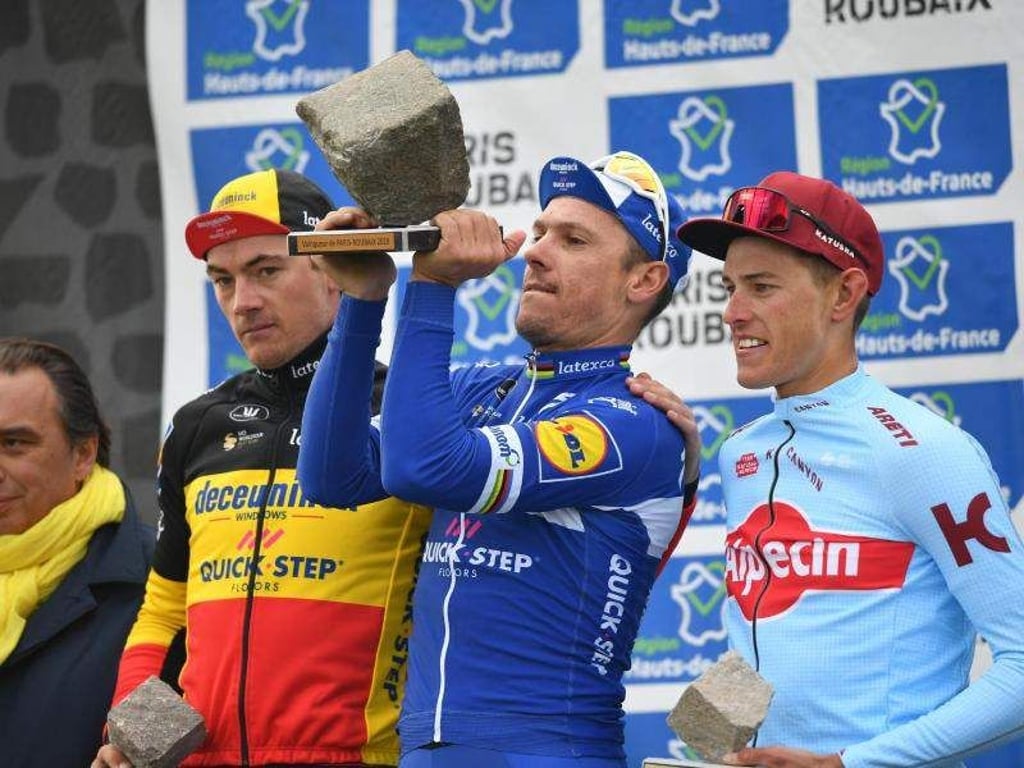 Das Podium: Ives Lampaert (l), Philippe Gilbert (M) und Nils Politt. Foto: David Stockman/BELGA
