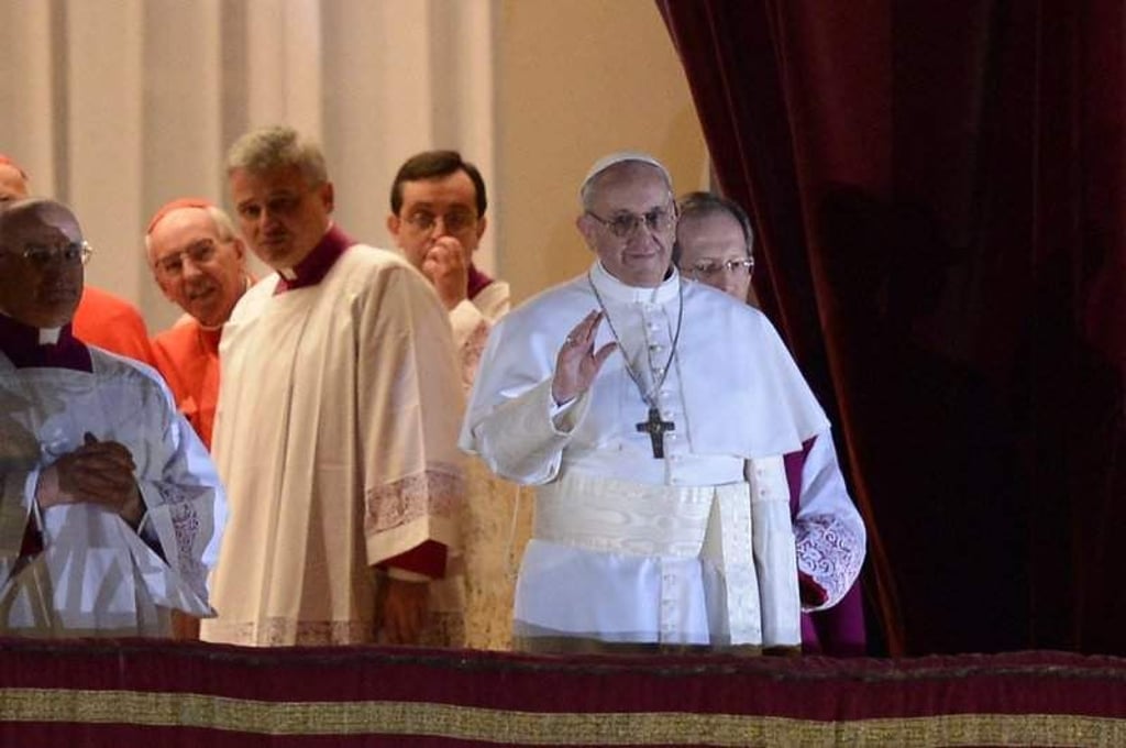 New Pope, Argentinian cardinal Jorge Mario Bergoglio appears at the window of St Peter's Basilica's balcony after being elected the 266th pope of the Roman Catholic Church on March 13, 2013 at the Vatican. AFP PHOTO / FILIPPO MONTEFORTE