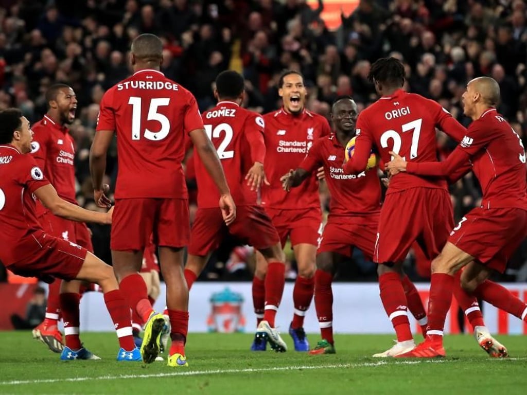Liverpools Mannschaft ist nach Origi's spätem Treffer in Jubelstimmung. Foto: Peter Byrne/PA Wire