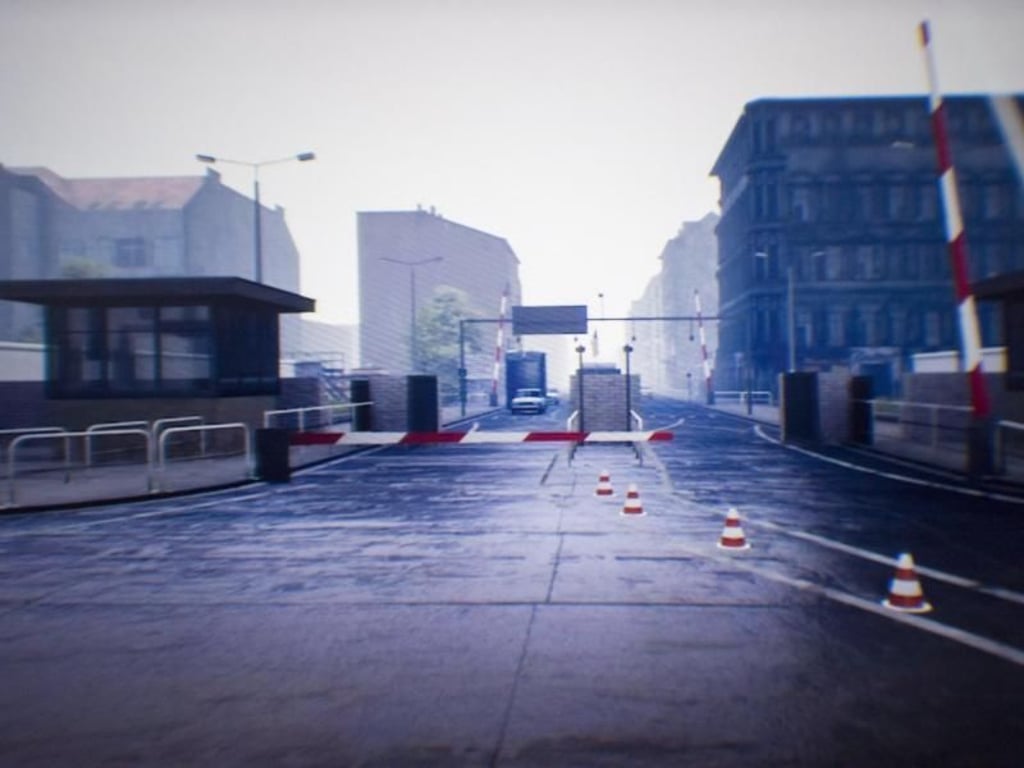 Ein Grenzübergang ist bei einer virtuellen Zeitreise in das geteilte Berlin in einer Virtual-Reality-Brille zu sehen. Foto: Christoph Soeder