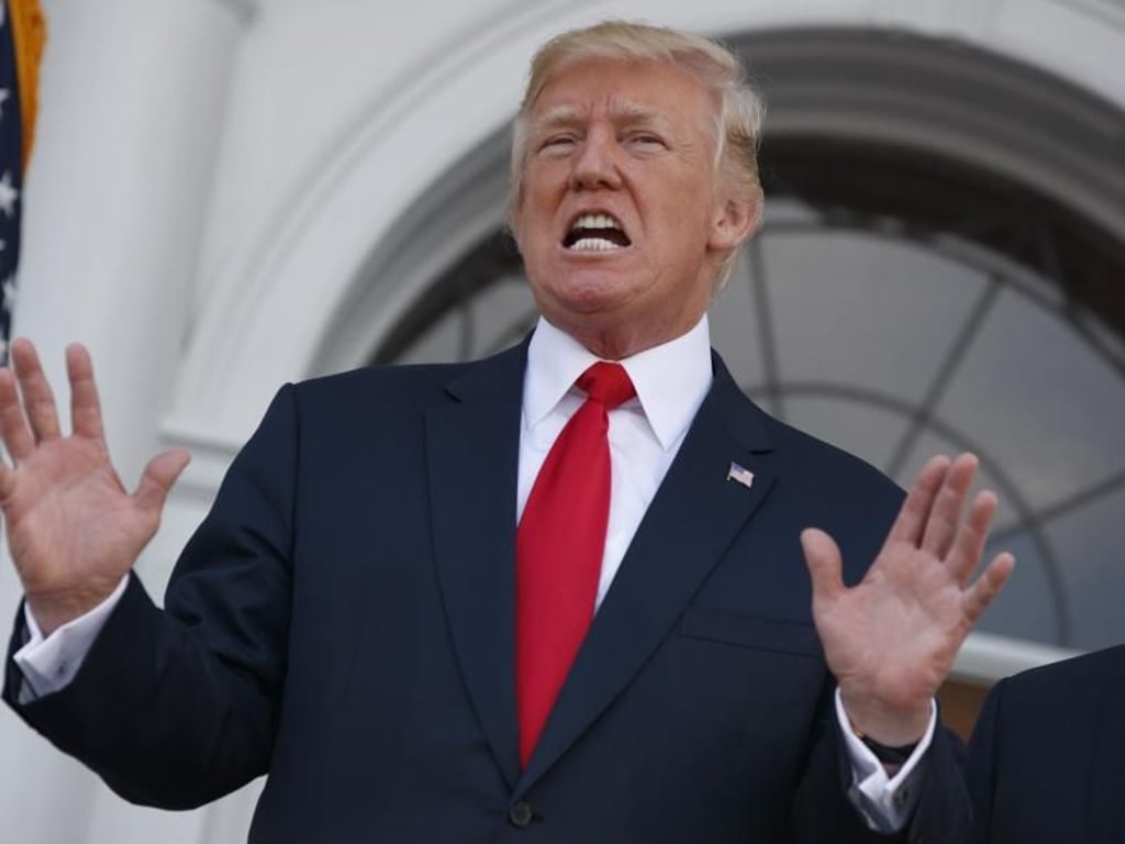 US-Präsident Donald Trump spricht am Trump National Golf Club in Bedminster über die Atomkrise mit Nordkorea. Foto: Evan Vucci