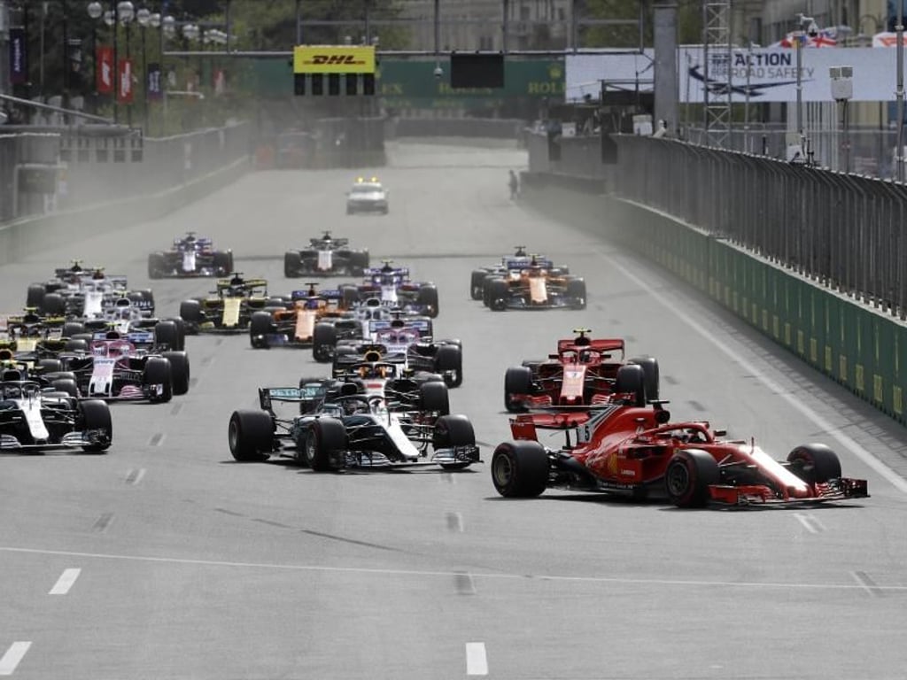 Am Start konnte Sebastian Vettel seine Spitzenposition noch behaupteten. Foto: Luca Bruno/AP