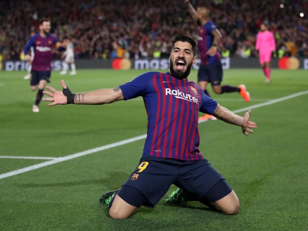 Luis Suarez rutscht nach seinem Tor zum 1:0 mit ausgebreiteten Armen über den Rasen. Foto: Nick Potts/PA Wire