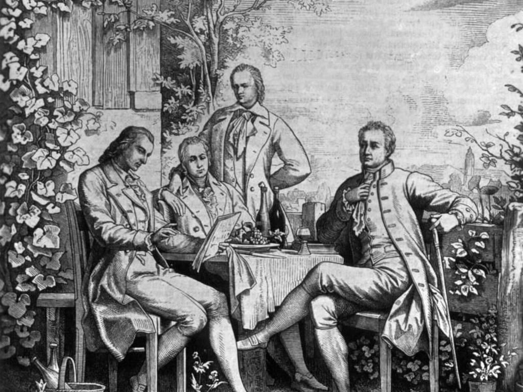 Der zeitgenössische Stich zeigt Alexander Freiherr von Humboldt (2.v.r) mit den deutschen Dichtern Johann Wolfgang von Goethe (r) und Friedrich Schiller (l), sowie Wilhelm (2.v.l) in Jena. Foto: dpa