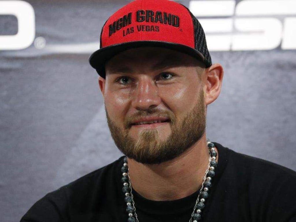 Boxer Tom Schwarz aus Deutschland lächelt im Rahmen einer Pressekonferenz. Foto: John Locher/AP/Archiv