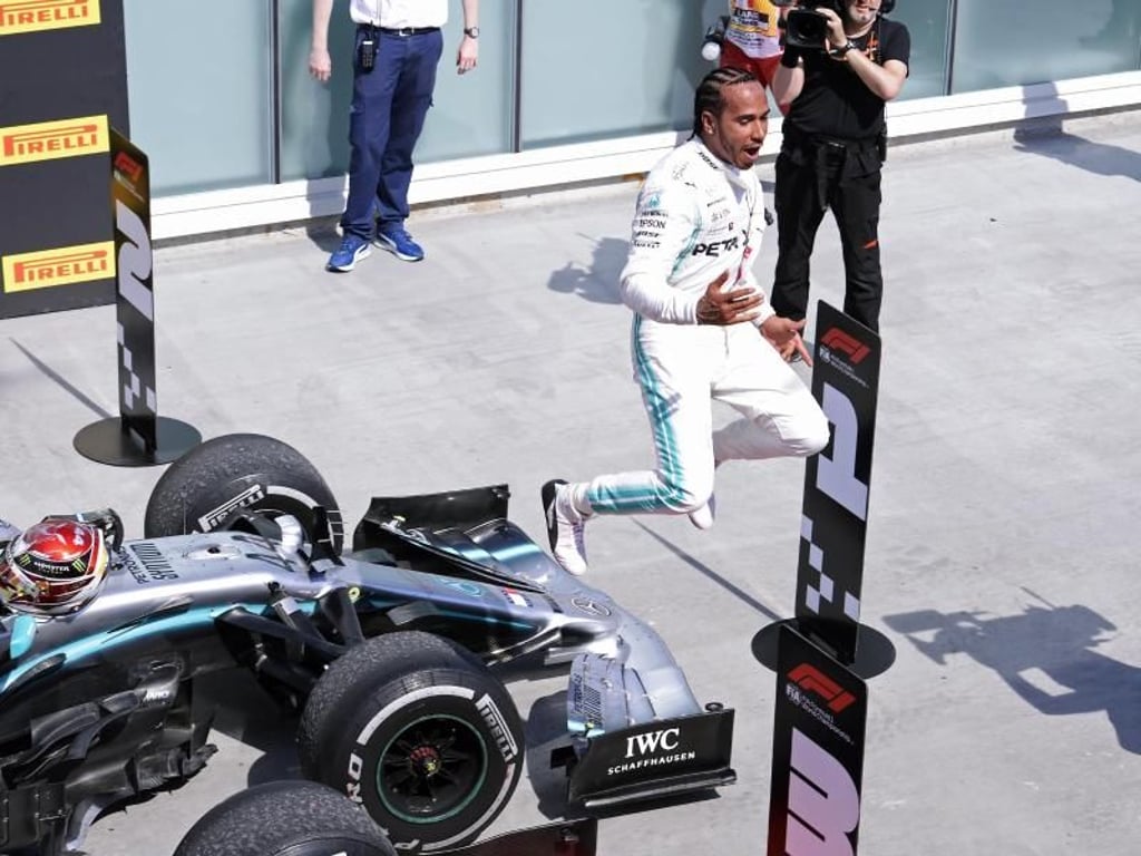 Lewis Hamilton feiert seinen Sieg. Foto: Paul Chiasson/The Canadian Press/AP