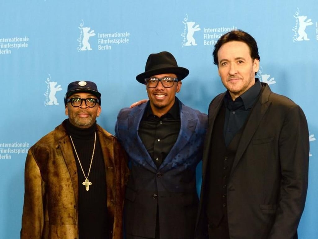 Spike Lee (l-r), Nick Cannon und John Cusack stellten ihr Musical «Chi-Raq» auf der Berlinale vor. Foto: Ralf Hirschberger