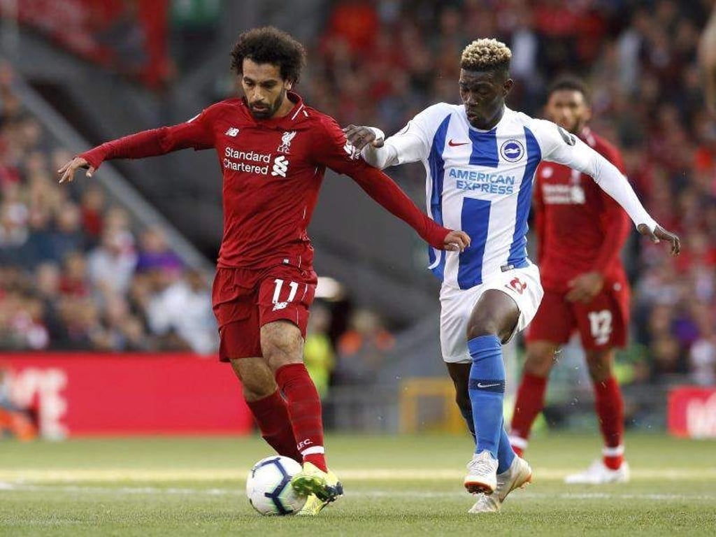 Mohamed Salah (l) schoss das entscheidende 1:0 gegen Brighton. Foto: Martin Rickett/PA
