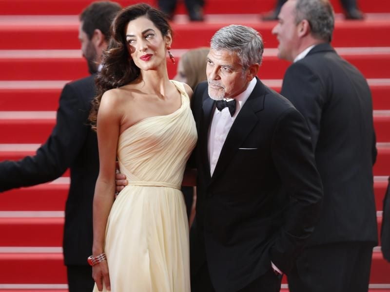 George und Amal Clooney auf dem roten Teppich. Foto: Ian Langsdon