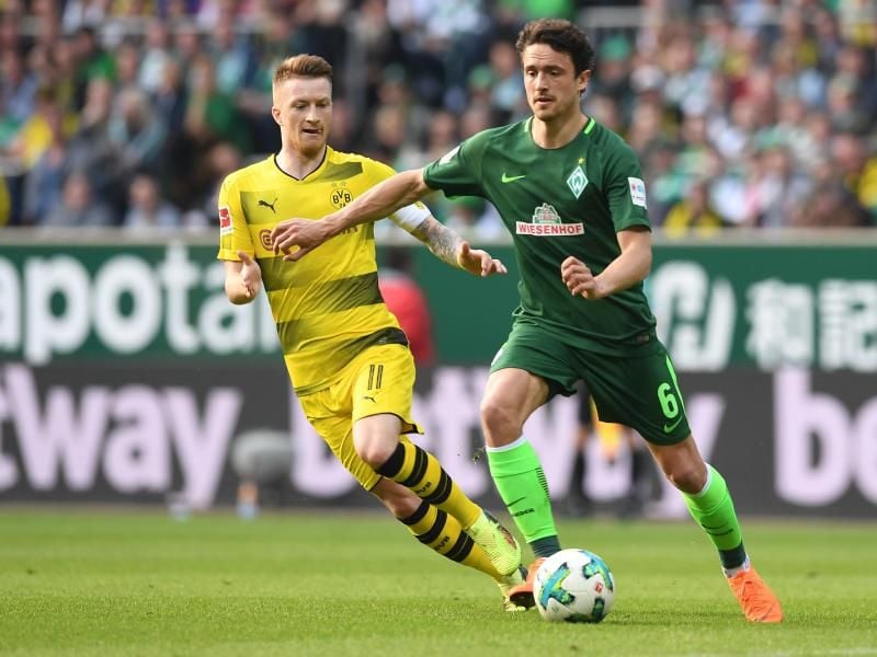 Torschützen unter sich: Werders Thomas Delaney (r) und Dortmunds Marco Reus. Foto: Carmen Jaspersen