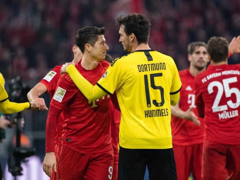 Treffen am Dienstag im Topspiel aufeinander: Bayern-Torjäger Robert Lewandowski (l) und BVB-Verteidiger Mats Hummels. Foto: Matthias Balk/dpa