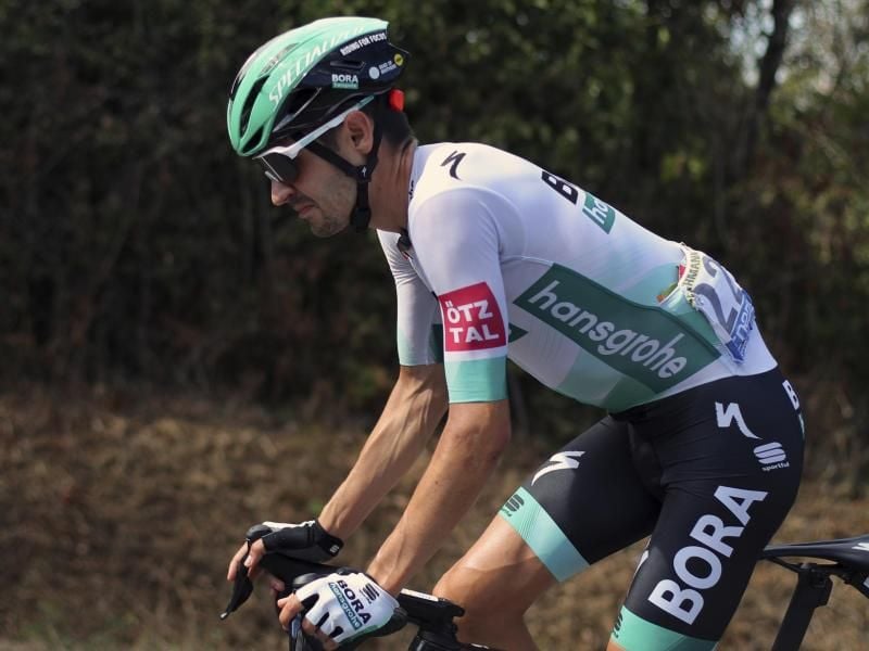 Geht angeschlagen in die letzte Woche der Tour de France: Emanuel Buchmann von Bora–hansgrohe in Aktion. Foto: Thibault Camus/AP/dpa