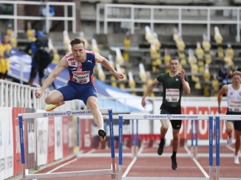 Karsten Warholm (l) hat seinen Europarekord über 400 Meter Hürden verbessert. Foto: Christine Olsson/TT NEWS AGENCY/dpa