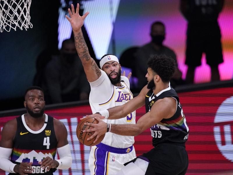 Jamal Murray (r) führte die Denver Nuggets zum Sieg. Foto: Mark J. Terrill/AP/dpa