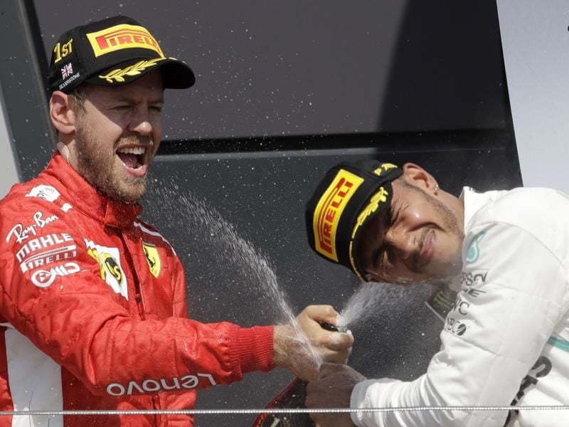 Konkurrenten auf der Rennbahn: Sebastian Vettel und Lewis Hamilton. Foto: Luca Bruno