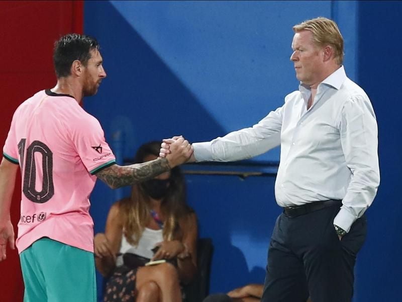 Lionel Messi (l) und Neu-Barca-Coach Ronald Koeman. Foto: Joan Monfort/AP/dpa