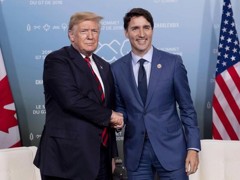 Kanadas Premierminister Justin Trudeau (R) und US-Präsident Donald Trump bei einem Treffen im Juni. Foto: Justin Tang/The Canadian Press