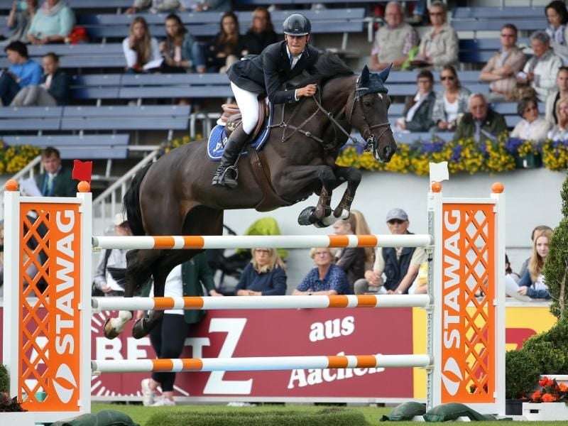 Der deutsche Springreiter Marcel Marschall siegt beim Championat von München. Foto: Friso Gentsch