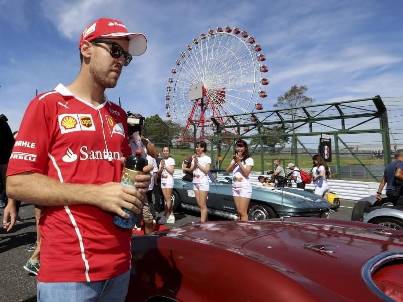 Will in Suzuka seine WM-Chancen wahren: Ferrari-Pilot Sebastian Vettel. Foto: Eugene Hoshiko/AP