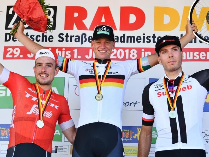 Pascal Ackermann (M) sicherte sich 2018 in Einhausen den deutschen Straßenmeistertitel. Foto: Uwe Anspach/dpa