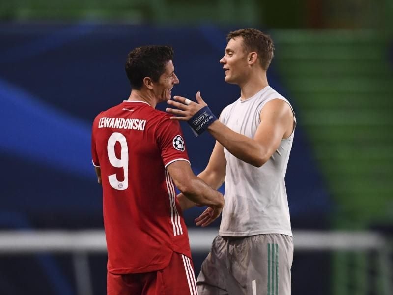 Holten mit Bayern das Triple: Torjäger Robert Lewandowski (l) und Torhüter Manuel Neuer. Foto: Franck Fife/pool AFP/AP/dpa