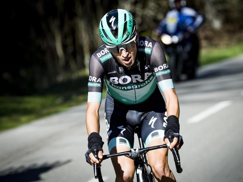 Emanuel Buchmann ist im Dauphiné-Klassement als Zwölfter bester Deutscher. Foto: Jean-Christophe Bott/KEYSTONE