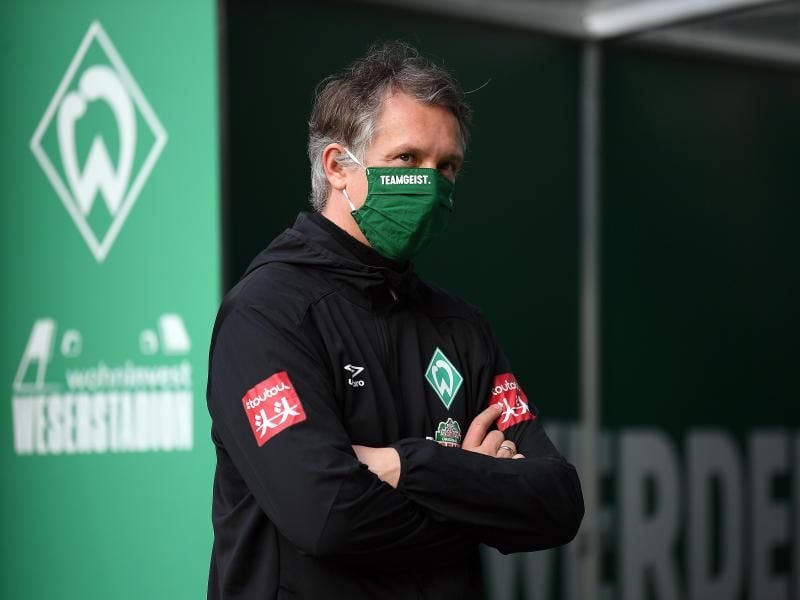 Sportdirektor von Werder Bremen: Frank Baumann steht mit Maske im Stadion. Foto: Stuart Franklin/Getty Images Europe/Pool/dpa
