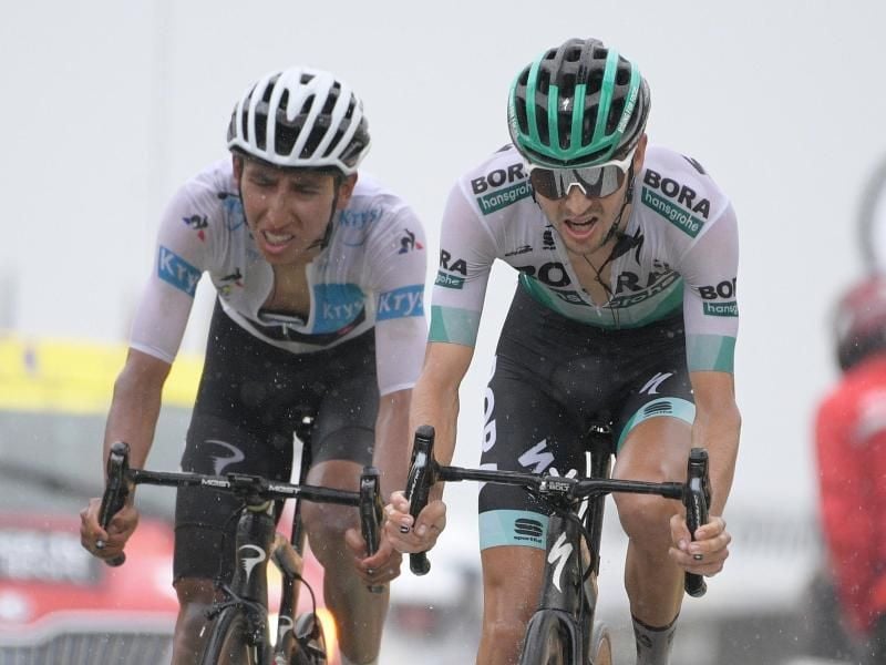 Buchmann (r) liegt in der Gesamtwertung auf Rang sechs, sein Rückstand auf Alaphilippe beträgt 2:14 Minuten. Foto: Yorick Jansens/BELGA