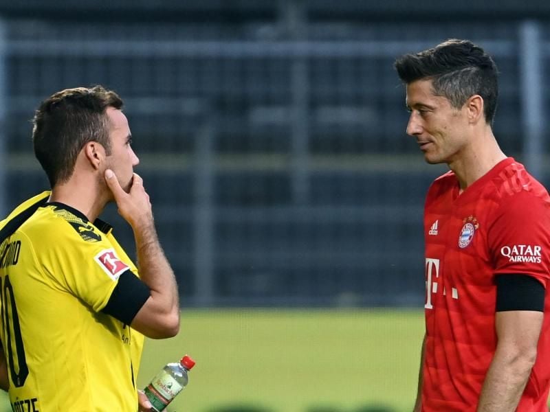 Wird BVB-Star Mario Götze (l) wieder Teamkollege von Bayern-Stürmer Robert Lewandowski?. Foto: Federico Gambarini/dpa-Pool/dpa